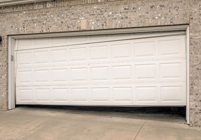 Broken garage door ready to being repaired in NJ