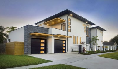 Clopay Modern Steel Collection garage door, grooved panel design with frosted glass windows down one side.