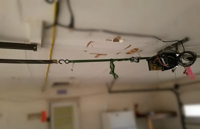 Damaged garage door opener that needs to be replaced in NJ 1