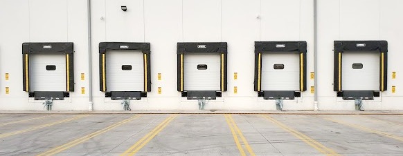 Loading Dock Bay with Loading Dock Equipment Sectional Doors, Dock Levelers, Dock Bumpers, Truck Restraints NJ-1
