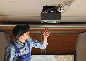 residential-garage-door-opener-being-serviced