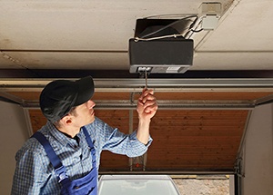 Residential Garage Door Opener Being Serviced