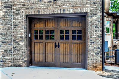 Arched-Top-Windows-Mullioned-Windows-Carriage-House-Garage-Door