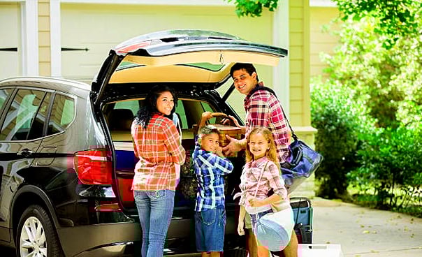 Tips to secure your garage door before an extended vacation; Family on vacation. Family going on vacation