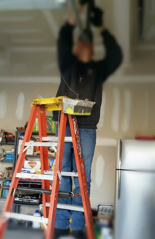 Why Does my Garage Door Squeak So Much; Professional Garage Door Serviceman.jpg