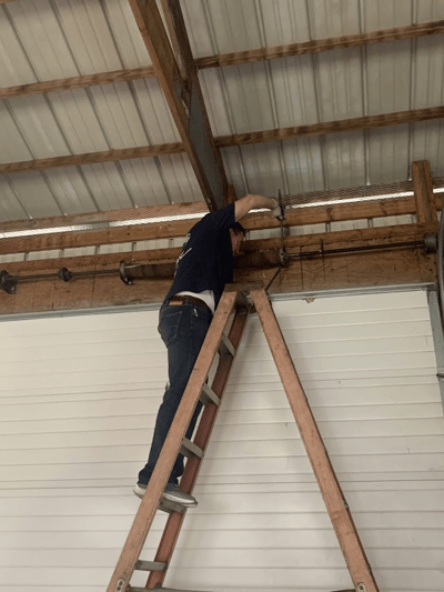 Technician repairing a commercial door in Central Jersey